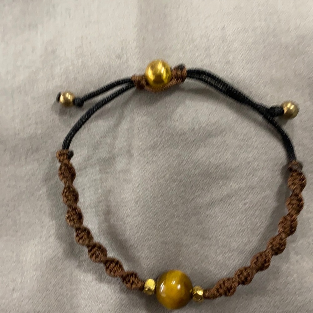 Beaded, knotted bracelet.